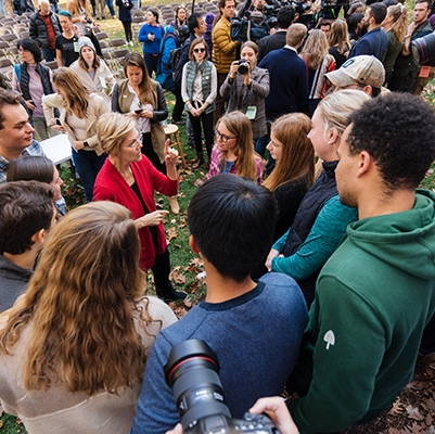 A photo of presidential candidate Elizabeth Warren visiting campus and talking with students