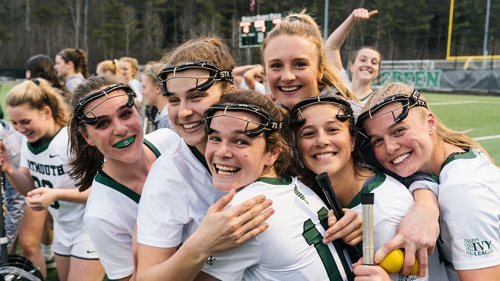 A photo of the women's lacrosse team celebrating after a game