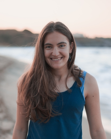a headshot picture of Kalina in a blue top