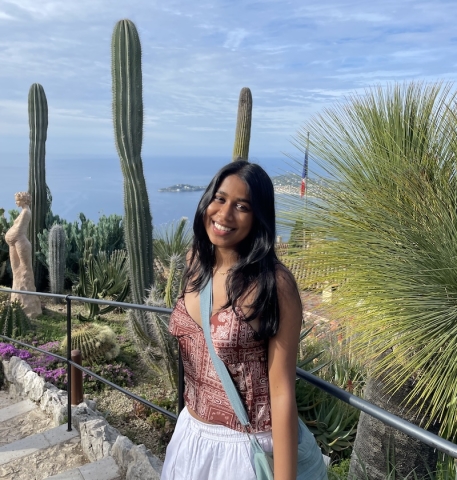 An image of a student in a botanical garden