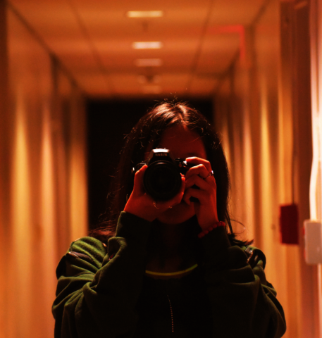 A photo of a person holding a camera