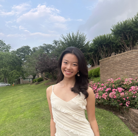 Crystal wearing a white dress