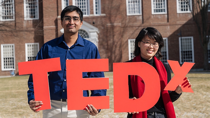 A photo of students holding Tedx letters