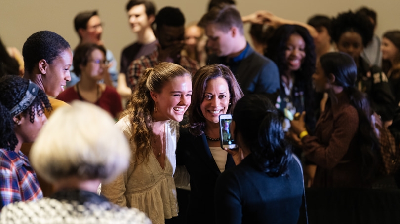Senator Kamala Harris poses with a student