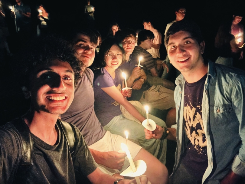 Selfie of friends holding candles