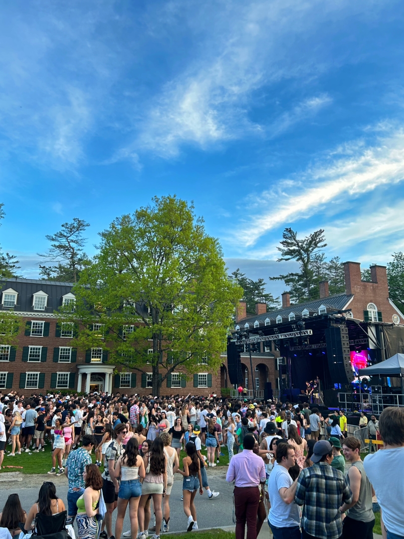 A stage with surrounding students