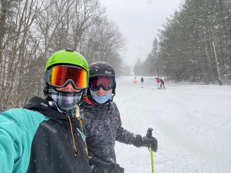 A picture of martin and his friend xavier on the main slope, selfie-style and in their full snow skiing gear!