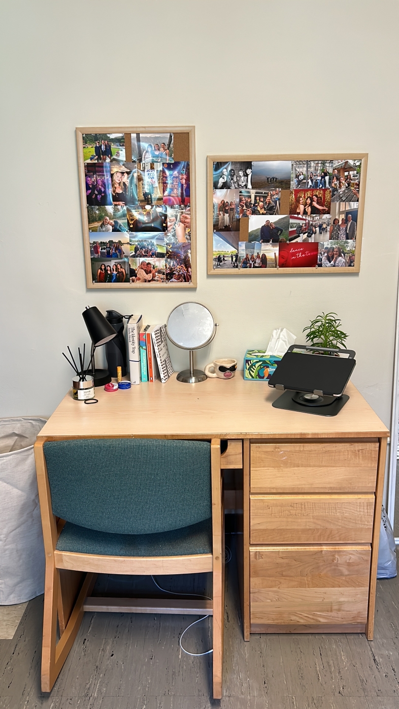 a desk with pictures behind it