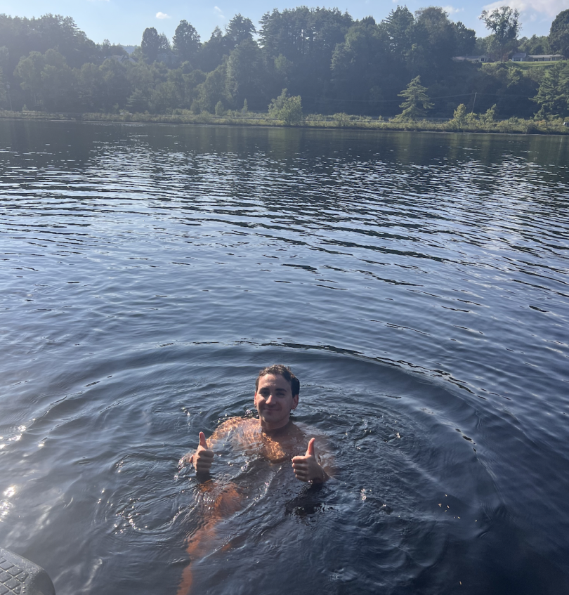 Blogger swimming in the Connecticut River making a thumbs up sign