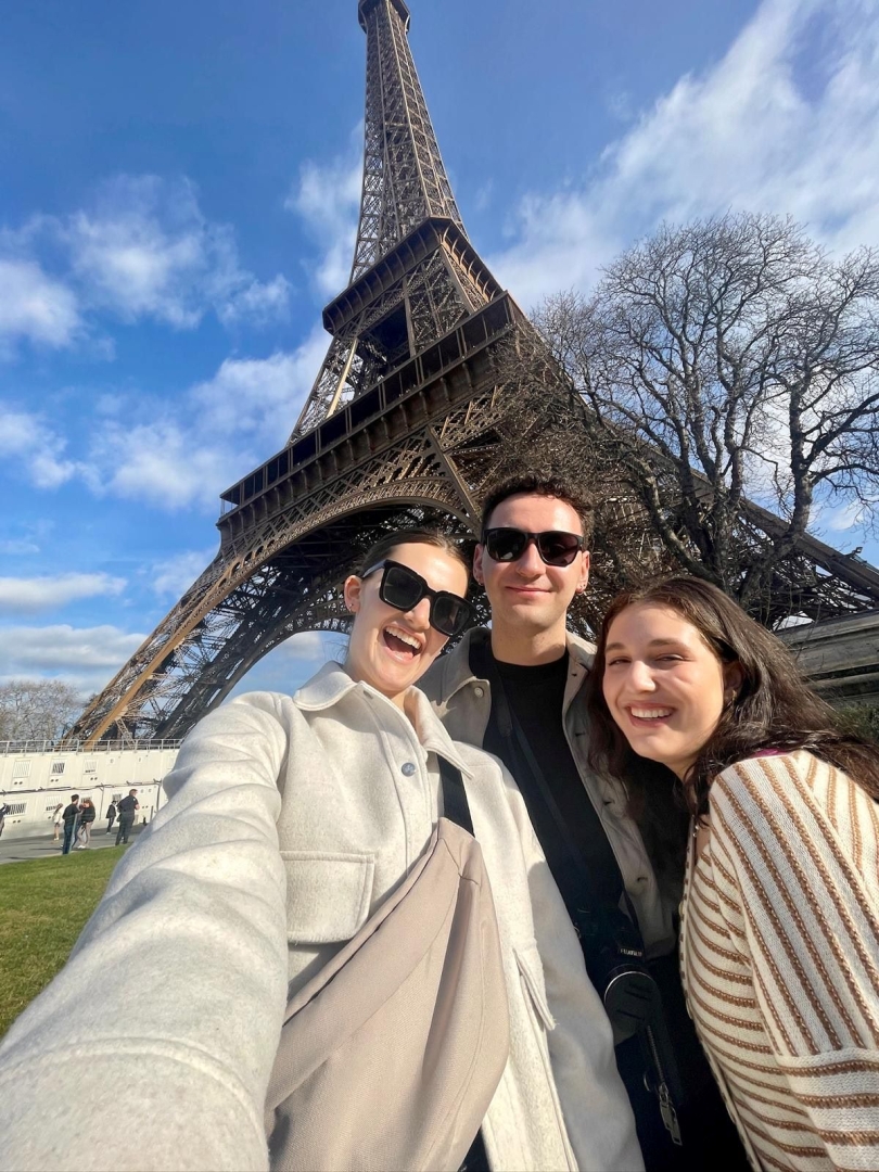A picture of Emma & her friends in front of the Eiffel Tower!