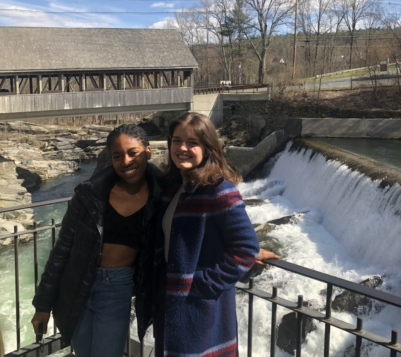 two friends in front of a waterfall