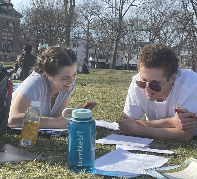 My friends Andre and Tess studying on the Green Two friends studying together