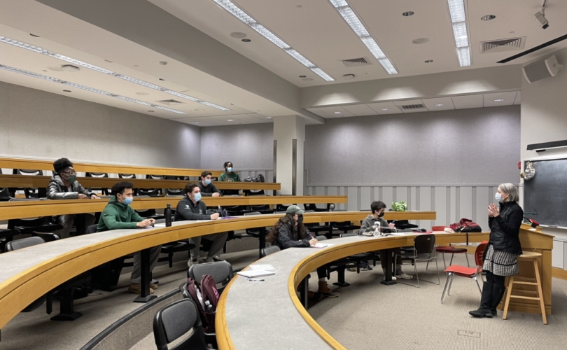 a classroom with students and a professor