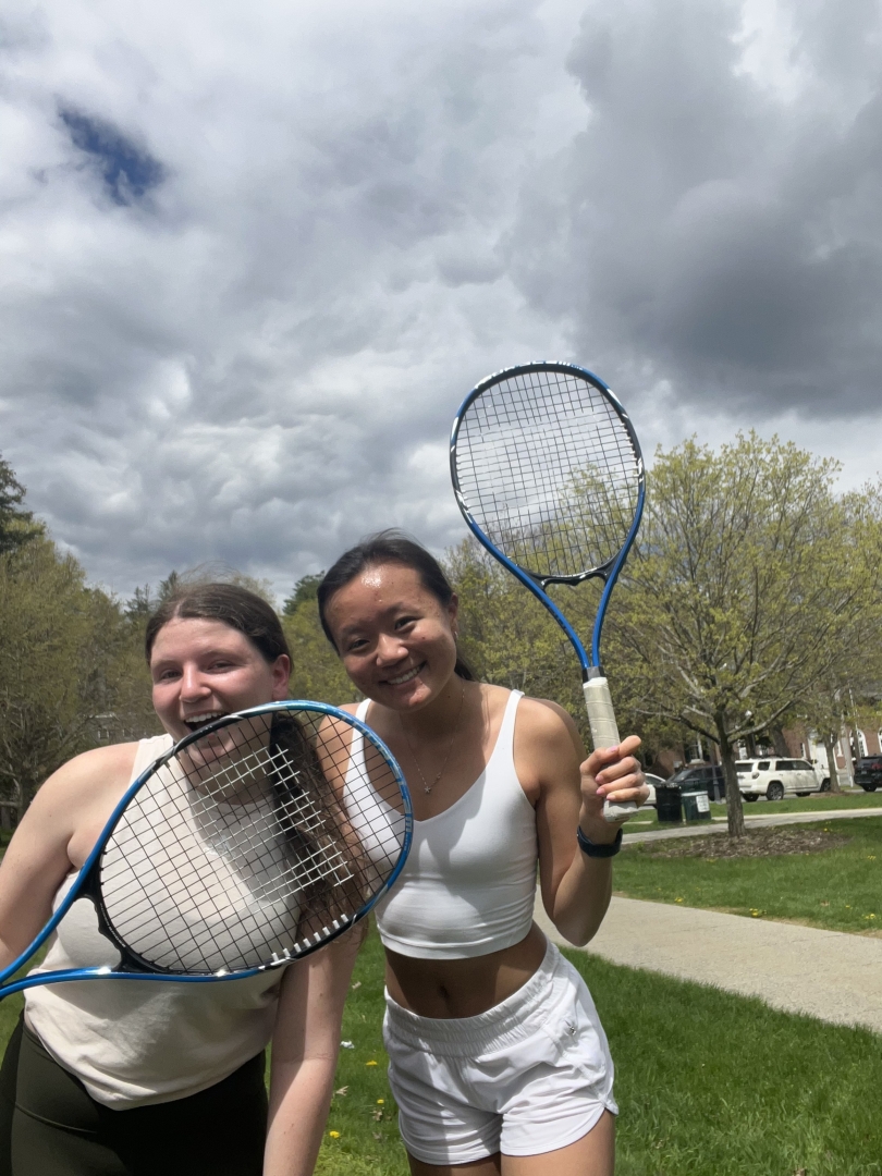 My friend Alexa and I pose with our tennis rackets after playing tennis.