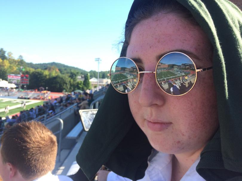 Tenor Sax player with glasses reflecting football field