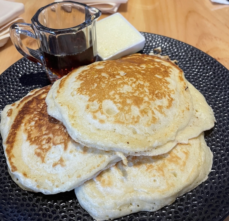 pancakes and syrup on a plate