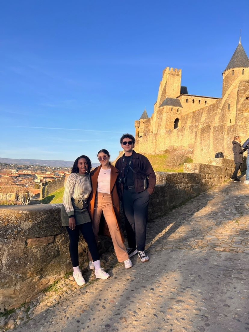 A picture of my friends and I standing in front of the castle.