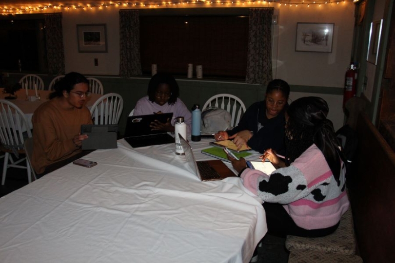 A picture of scholars studying for biology and chemistry with Manuel Patiño.