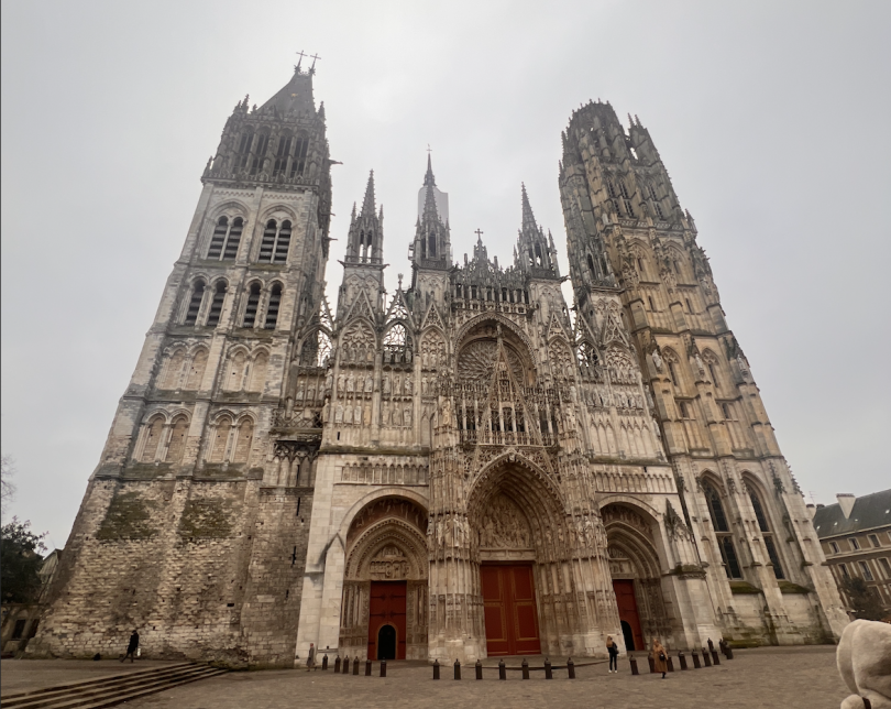 Facade of an old gothic cathedral with incredibly detailed sculpture work.