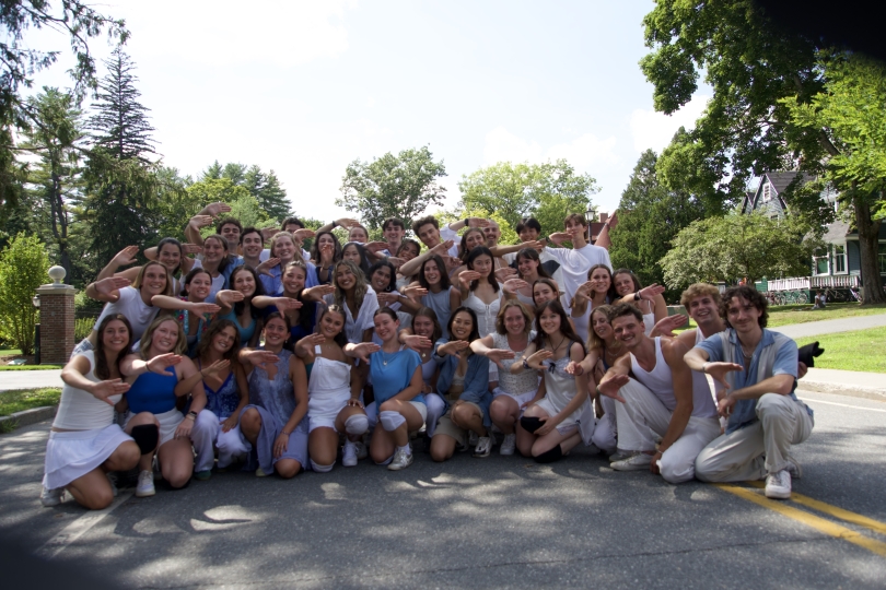 Shebalite, my summer dance troupe! A group of dancers in blue and white pose together outdoors, making a synchronized hand gesture.