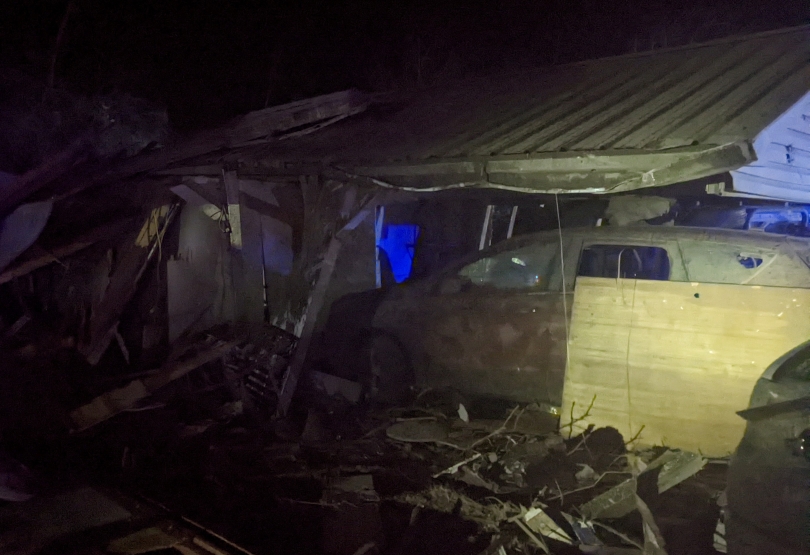 Another house destroyed, car smashed.
