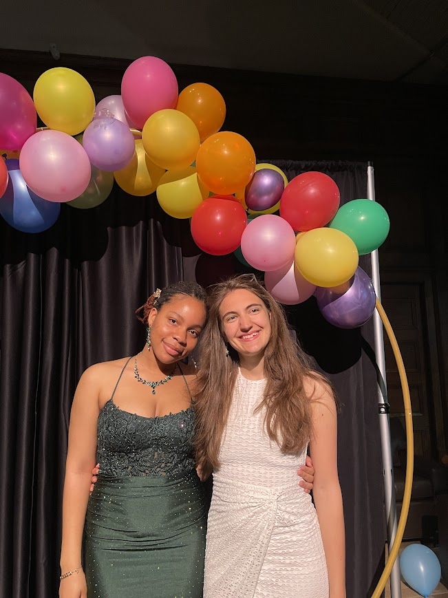 A picture of Deborah and Kalina under a balloon arch
