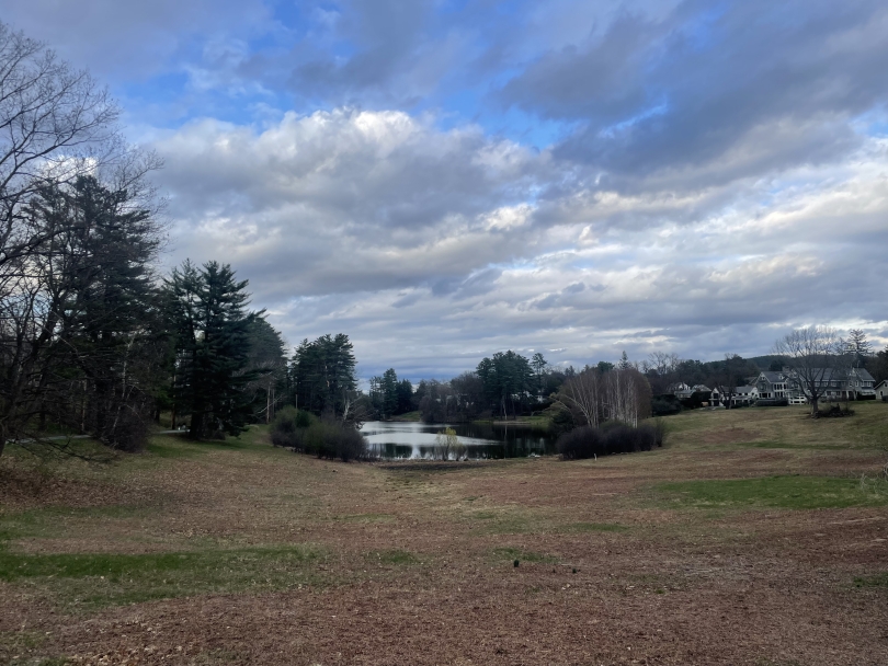 Occom Pond near the horizon on a cool, mildy cloudy afternoon day