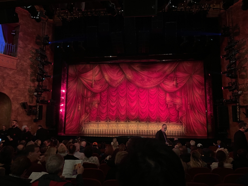 An image of front row seats inside a broadway musical venue in New York City