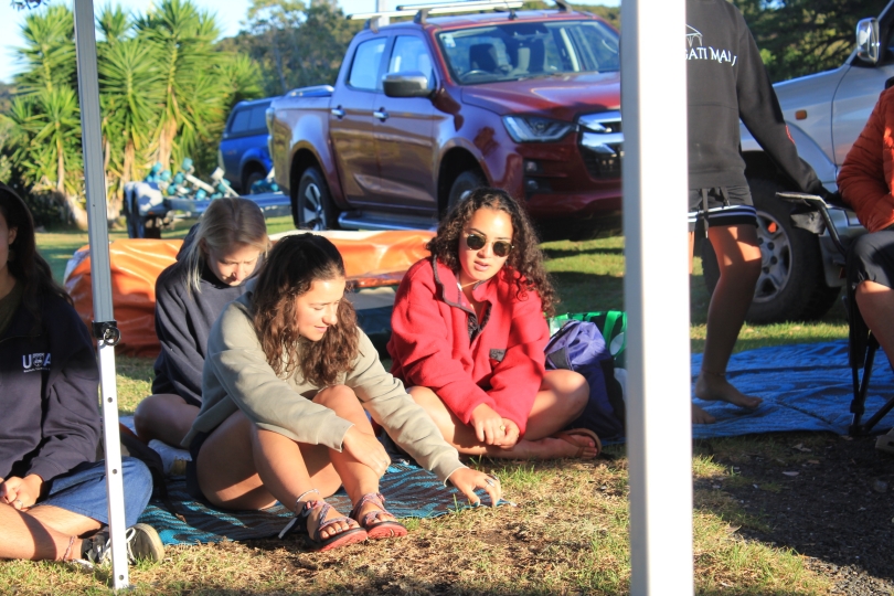students sitting outside