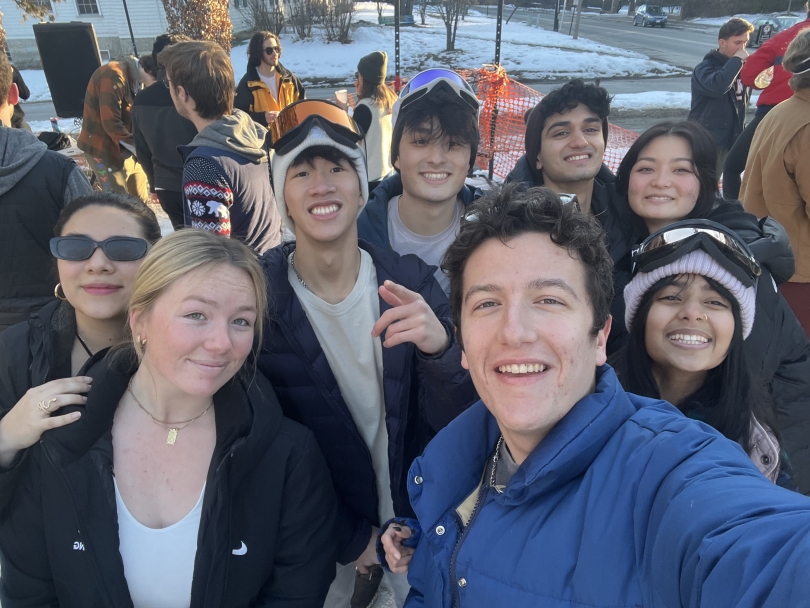 Friends spending time outside in the snow during Winter Carnival