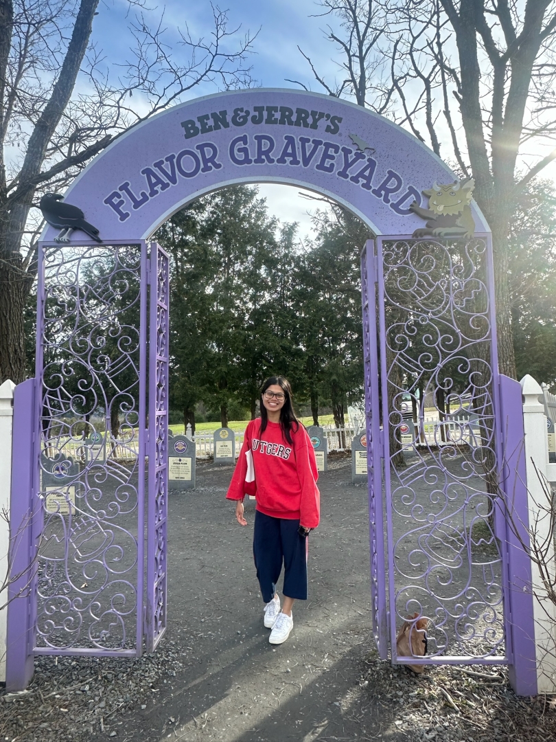 Diana standing in front of the Ben and Jerry's "Flavor Graveyard" 