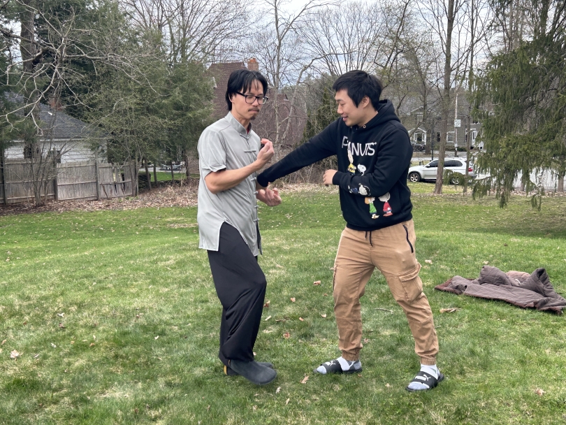 George Leung '07 and Yeel Lee '26 in a martial arts demonstration