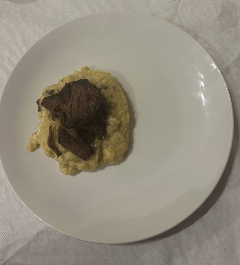 Mississippi Pot Roast Style Beef served on a bed of Cheesy Grits with Mushrooms and Onions
