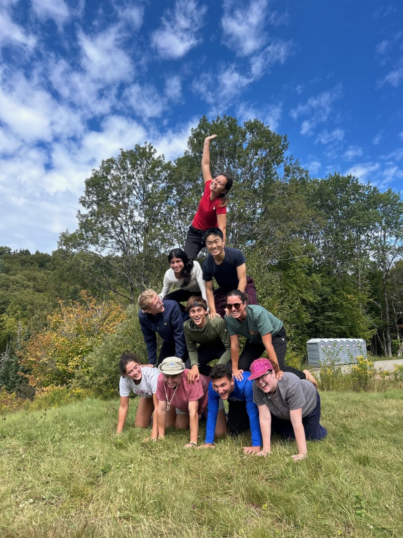 a photo of martin and his trippees in a human pyramid, which fell a second after this photo was taken