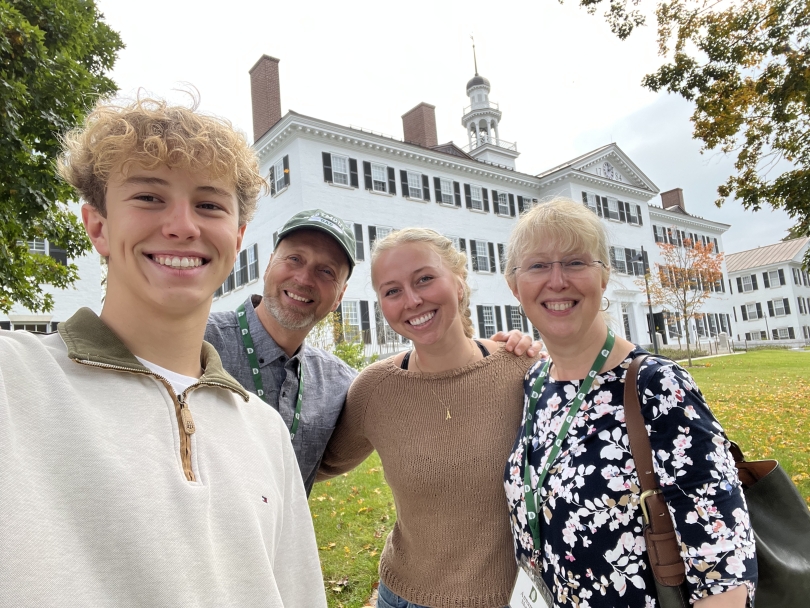 martin and his family taking a selfie in front of Dartmouth hall