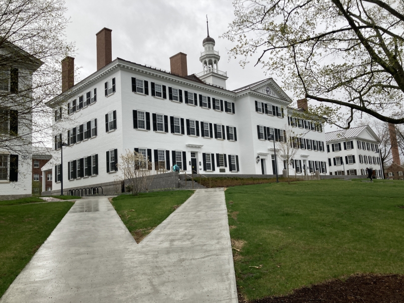 A view of Dartmouth Hall from the sidewalk on a cloudy day