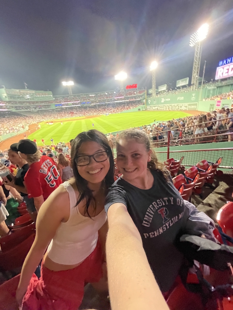 Diana and her roommate taking a selfie in front of the Red Sox stadium