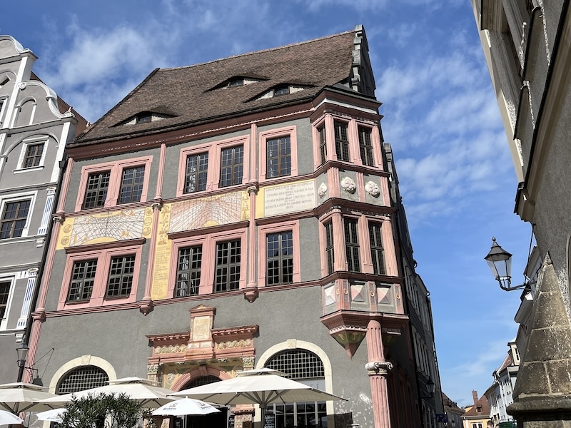 An image of a tall house with colourful walls