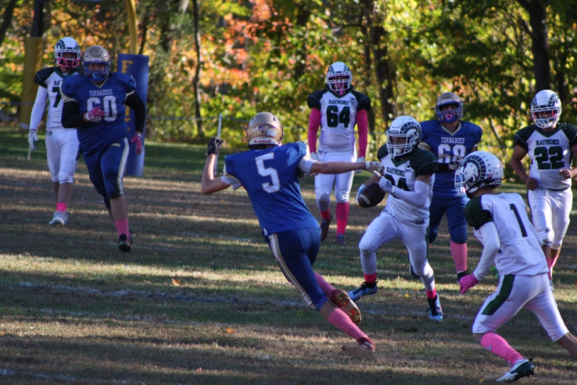 This is a photo I took of my brother playing football that also has his other teammates and the defending team.