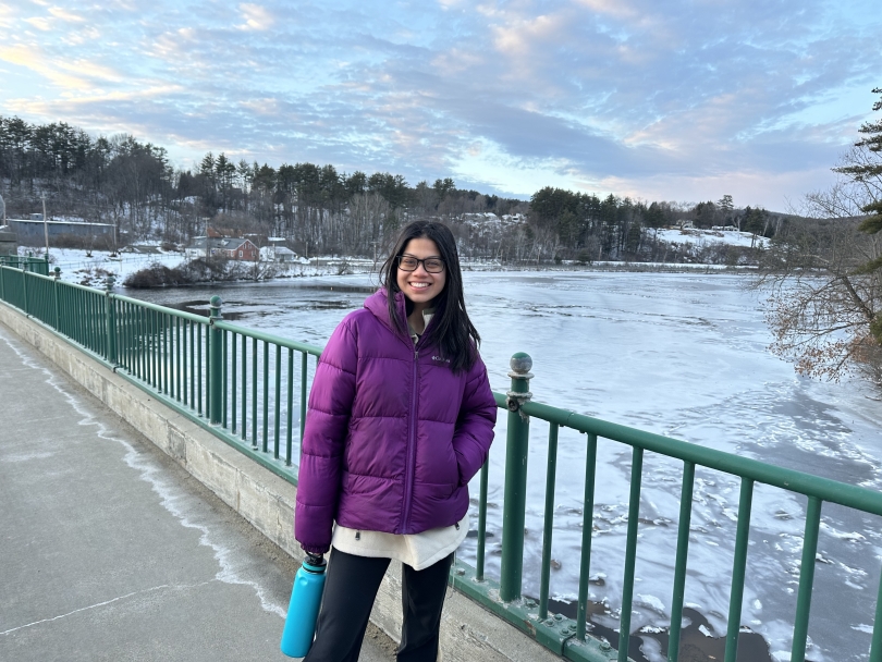 Diana standing on the border between Vermont and New Hampshire on Ledyard Bridge