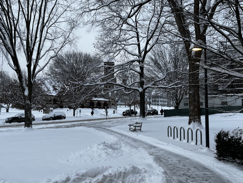 A photo of a snowy Dartmouth campus viewed from the east exit of Baker-Berry Library