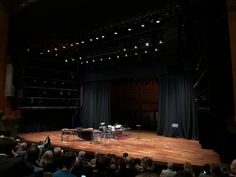 an image of a stage with two marimbas and four drum sets on it