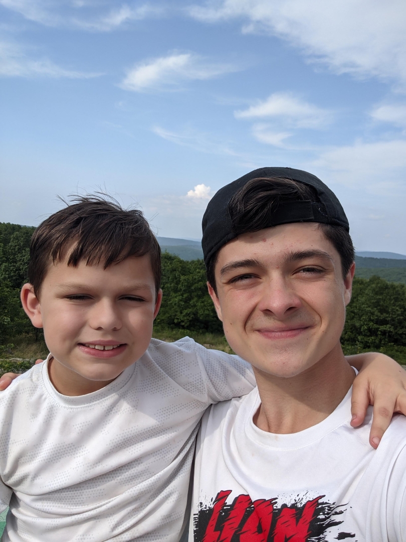 Picture of me and my little brother overlooking a beautiful rolling hill range in Missouri. 