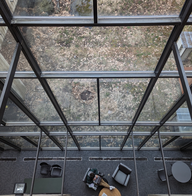 A student studying in the very aesthetically pleasing Fairchild Tower!