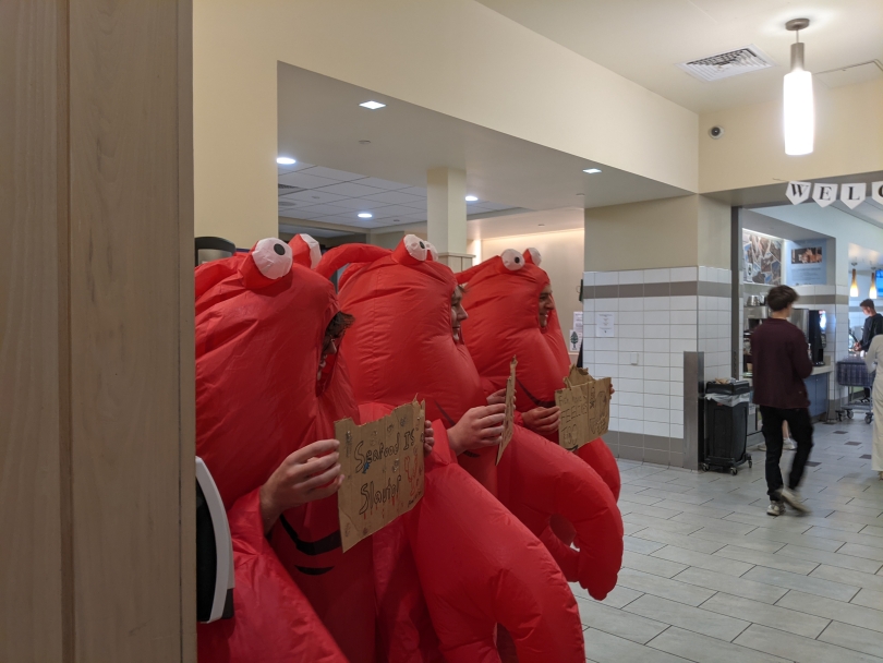 Students dressed up as lobsters in the dining hall protesting the salmon option that night
