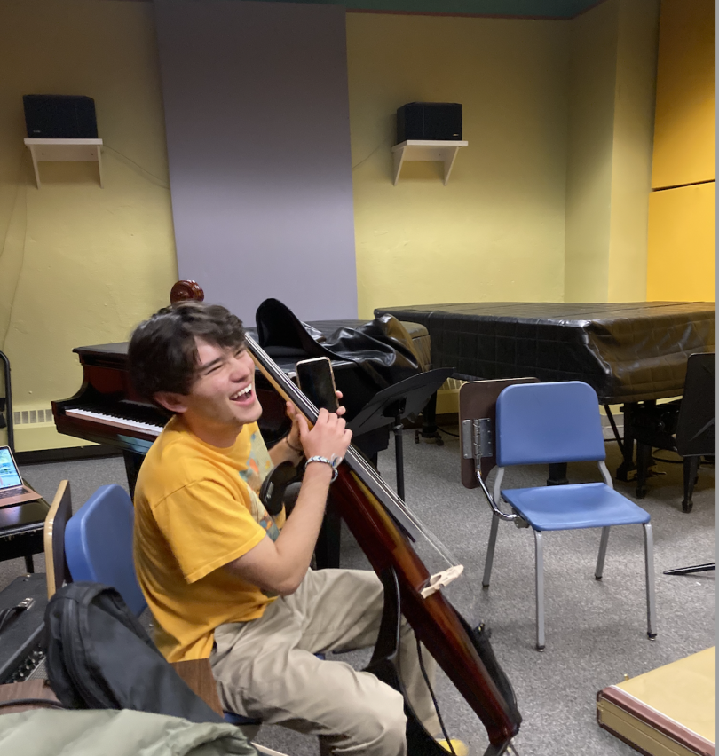 The cellist laughing with his bandmates!