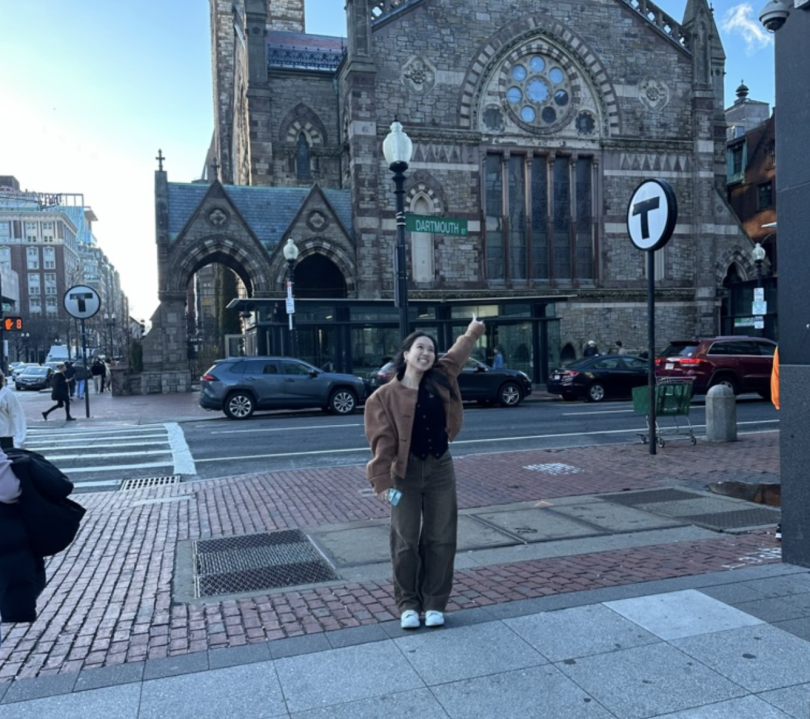 Nikki pointing to the Dartmouth Street sign in Boston!