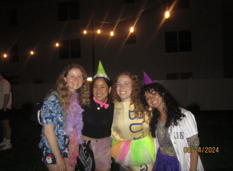 Four girls dressed in silly, brightly-colored clothing