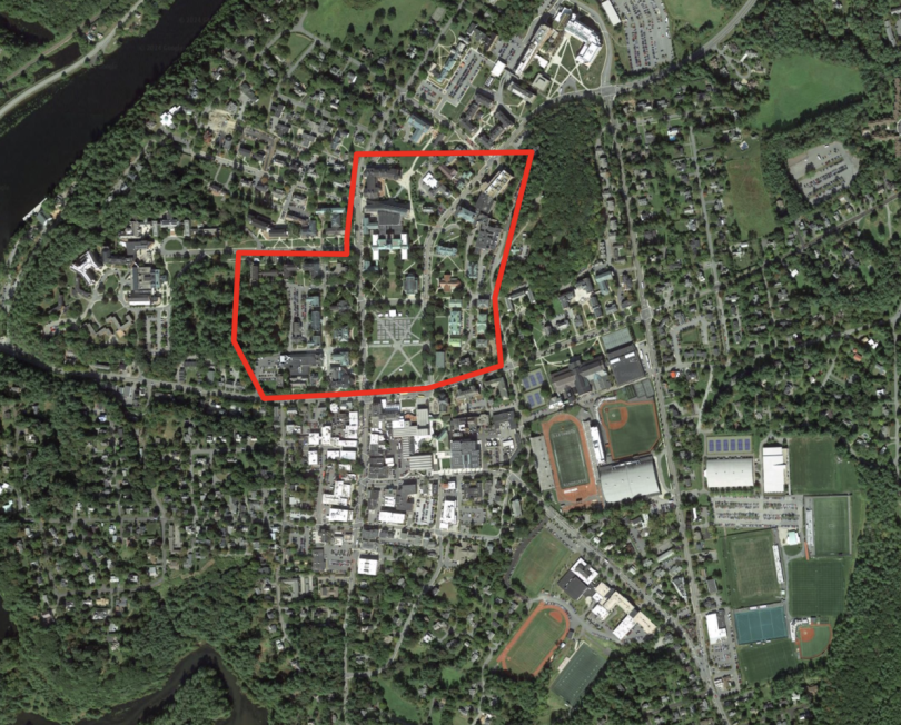 Central campus encircled by a red line in the overhead satellite shot. 