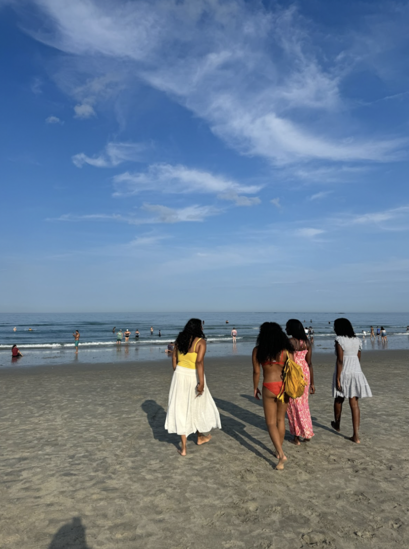 A photo of my friends and I walking towards the ocean. 